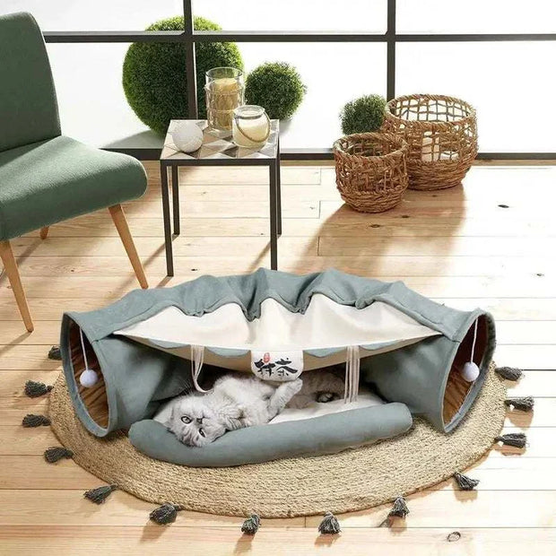 Plush bed with tunnel for indoor cats, featuring a multi-purpose design for play and relaxation.