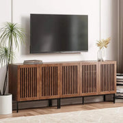 Farmhouse TV Stand with storage cabinets and metal base in a modern living room setting.