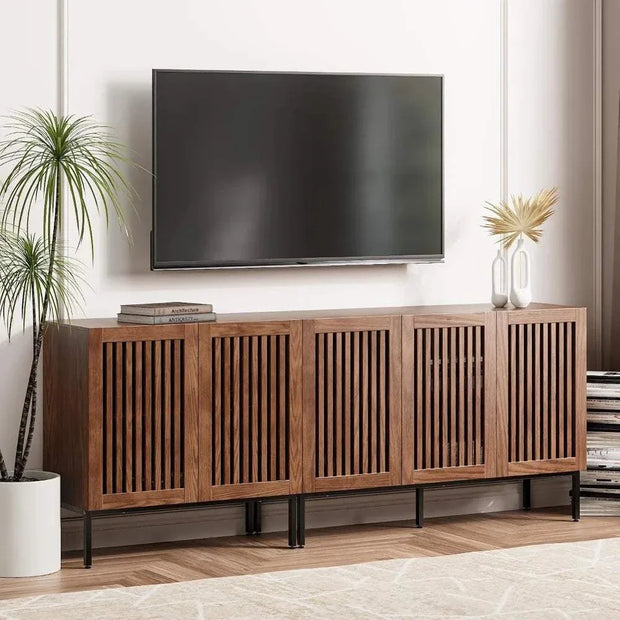 Farmhouse TV Stand with storage cabinets and metal base in a modern living room setting.
