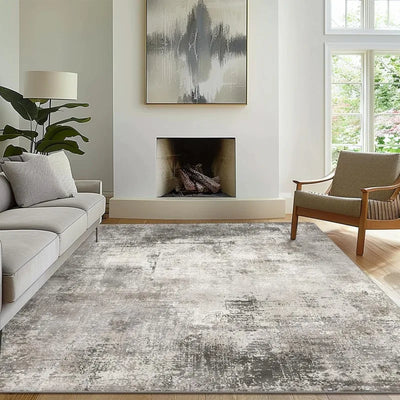 Modern abstract area rugs 8x10 in a living room setting, soft polyester, misty gray design.