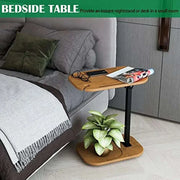 Adjustable height C-shaped end table in wood finish, placed beside sofa, ideal for small spaces.